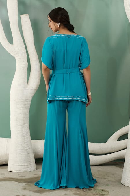 One Knot One By Ashna Blue Georgette Cut Work Cutdana Embroidered Tunic And Flared Pant Set Online at Aza Fashions One Knot One By Ashna_Blue Georgette Cut Work Cutdana Embroidered Tunic And Flared Pant Set _Online_at_Aza_Fashions