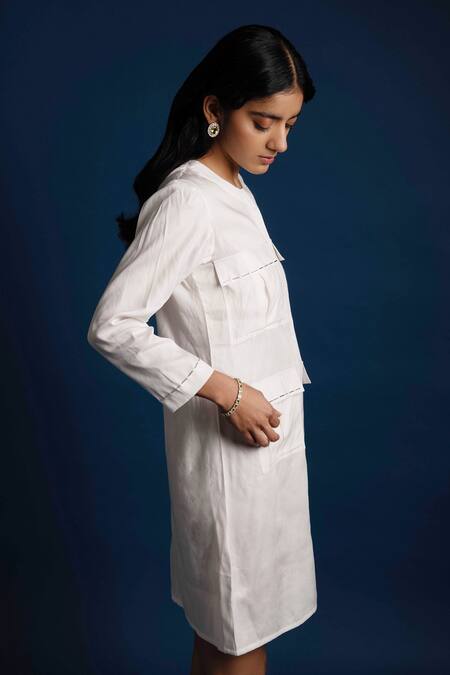 Shop Khajoor Studio White Linen Beads Round Neck Candle Short Pocket Dress Online at Aza Fashions Shop_Khajoor Studio_White Linen Beads Round Neck Candle Short Pocket Dress _Online_at_Aza_Fashions
