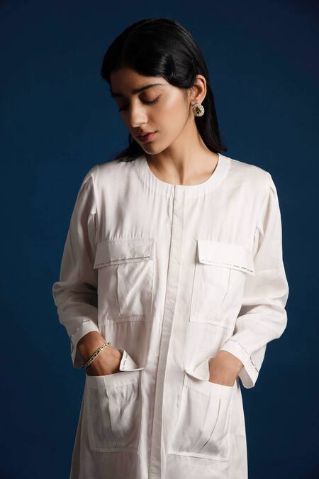 Khajoor Studio White Linen Beads Round Neck Candle Short Pocket Dress at Aza Fashions Khajoor Studio_White Linen Beads Round Neck Candle Short Pocket Dress _at_Aza_Fashions