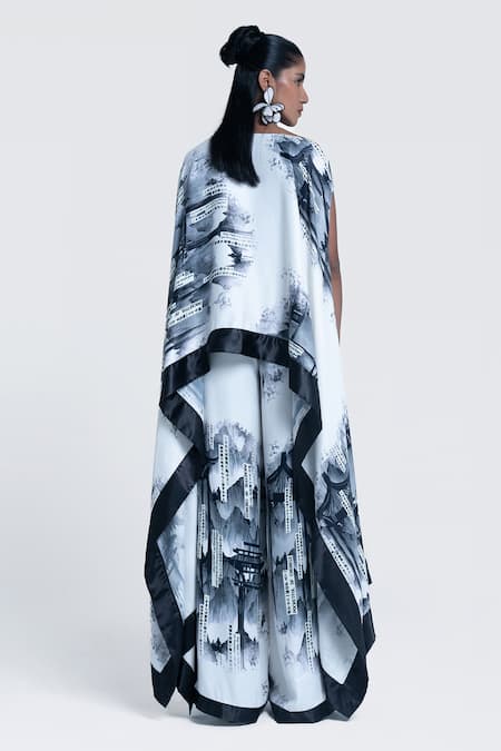Pocketful Of Cherrie_White Viscose, Satin Boat Neck Faded Gazette Print Poncho _Online_at_Aza_Fashions