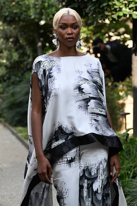 Buy_Pocketful Of Cherrie_White Viscose, Satin Boat Neck Faded Gazette Print Poncho _Online_at_Aza_Fashions