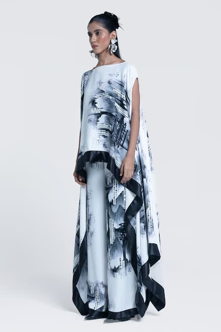 Pocketful Of Cherrie_White Viscose, Satin Boat Neck Faded Gazette Print Poncho _at_Aza_Fashions