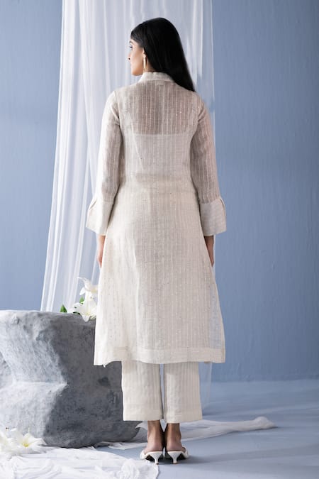 Shop Oja Ivory Linen Sequins Shawl Neck Bead Embroidered Floral Shirt Tunic With Pant at Aza Fashions Shop_Oja_Ivory Linen Sequins Shawl Neck Bead Embroidered Floral Shirt Tunic With Pant _at_Aza_Fashions