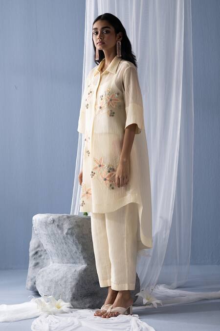 Shop Oja Ivory Cotton Embroidery, Sequins Collared Floral High-low Tunic With Pant Online at Aza Fashions Shop_Oja_Ivory Cotton Embroidery, Sequins Collared Floral High-low Tunic With Pant _Online_at_Aza_Fashions