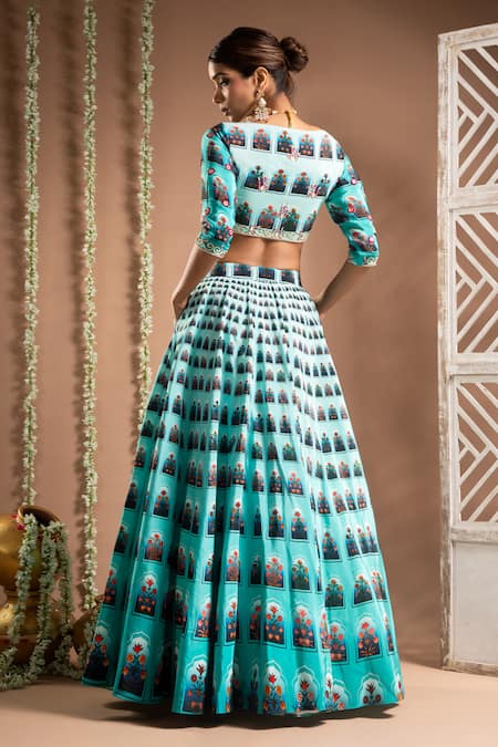 Shop Ahi Clothing Blue Crepe Mirrors, Zari Plunge Neck Floral Jharokha Print Lehenga With Bustier at Aza Fashions Shop_Ahi Clothing_Blue Crepe Mirrors, Zari Plunge Neck Floral Jharokha Print Lehenga With Bustier _at_Aza_Fashions