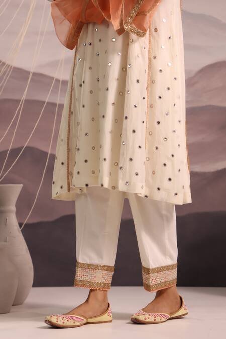 Omi Off White Chanderi Embroidered Mirror Notched Sana Work Kurta Pant Set at Aza Fashions Omi_Off White Chanderi Embroidered Mirror Notched Sana Work Kurta Pant Set _at_Aza_Fashions