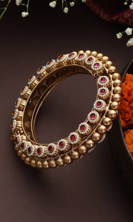 Shop Swabhimann Red Stones, Pearls And Embellished Carved Bangle at Aza Fashions Shop_Swabhimann_Red Stones, Pearls And Embellished Carved Bangle_at_Aza_Fashions