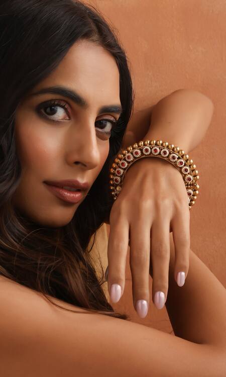 Swabhimann Red Stones, Pearls And Embellished Carved Bangle Online at Aza Fashions Swabhimann_Red Stones, Pearls And Embellished Carved Bangle_Online_at_Aza_Fashions