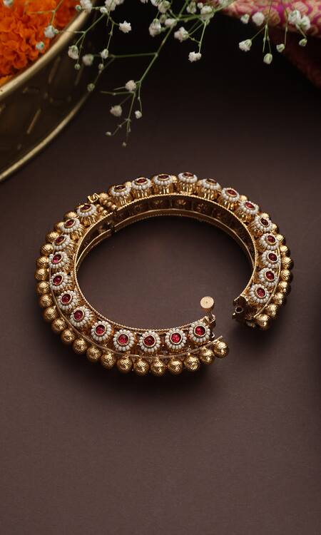 Buy Swabhimann Red Stones, Pearls And Embellished Carved Bangle Online at Aza Fashions Buy_Swabhimann_Red Stones, Pearls And Embellished Carved Bangle_Online_at_Aza_Fashions
