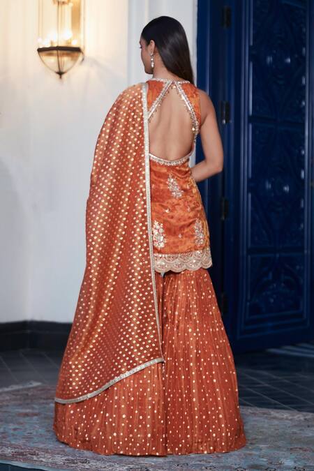 Shop Basanti - Kapde Aur Koffee Orange Tissue Sequins Round Neck Floral Embroidered Kurta Sharara Set at Aza Fashions Shop_Basanti - Kapde Aur Koffee_Orange Tissue Sequins Round Neck Floral Embroidered Kurta Sharara Set_at_Aza_Fashions