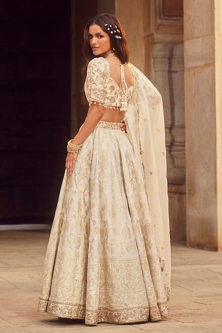 Lashkaraa_Off White Brocade, Organza Sequins, Beads, Zari V-neck Floral Woven Lehenga Set _Online_at_Aza_Fashions