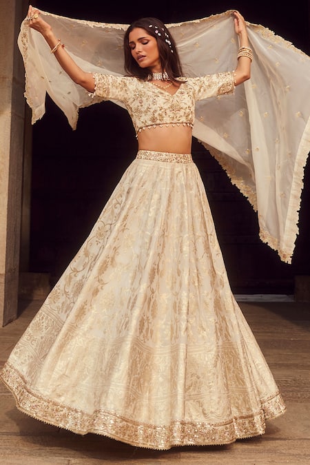 Lashkaraa_Off White Brocade, Organza Sequins, Beads, Zari V-neck Floral Woven Lehenga Set _at_Aza_Fashions