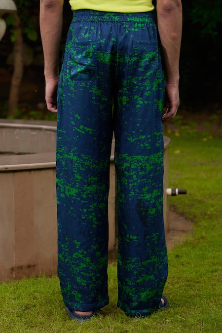 Shop Triune Green Tencel Satin Abstract Triune Beach Club Pattern Pant at Aza Fashions Shop_Triune_Green Tencel Satin Abstract Triune Beach Club Pattern Pant_at_Aza_Fashions