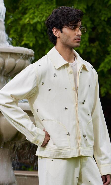 Triune_White Cotton Embellished Metal Studs Sand Beach Blouson Jacket _Online_at_Aza_Fashions