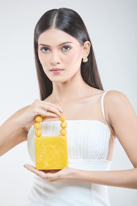 Shop Boxwish By Bhumika Yellow Pearls Handle Swerve Texture Resin Clutch Bag at Aza Fashions Shop_Boxwish By Bhumika_Yellow Pearls Handle Swerve Texture Resin Clutch Bag _at_Aza_Fashions