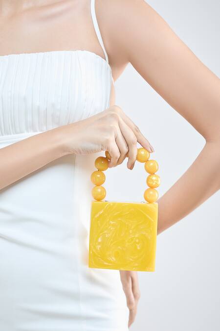 Boxwish By Bhumika Yellow Pearls Handle Swerve Texture Resin Clutch Bag Online at Aza Fashions Boxwish By Bhumika_Yellow Pearls Handle Swerve Texture Resin Clutch Bag _Online_at_Aza_Fashions