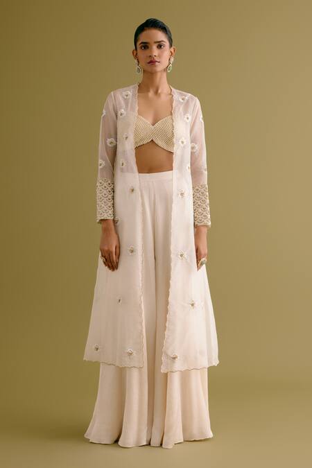 Shop Devnaagri Ivory Organza, Satin Pearls, Sequins Embroidered Jacket Sharara Set Online at Aza Fashions Shop_Devnaagri_Ivory Organza, Satin Pearls, Sequins Embroidered Jacket Sharara Set _Online_at_Aza_Fashions