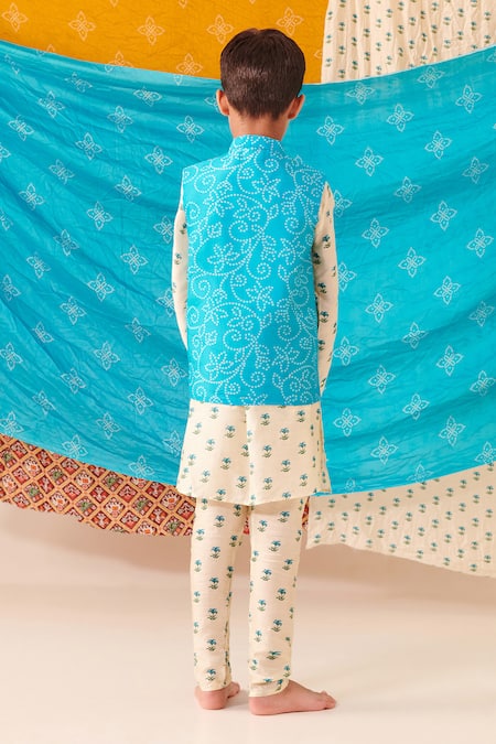 Shop Cute Couture Blue Cotton Print Bandhani Floral Bundi Kurta Set at Aza Fashions Shop_Cute Couture_Blue Cotton Print Bandhani Floral Bundi Kurta Set _at_Aza_Fashions