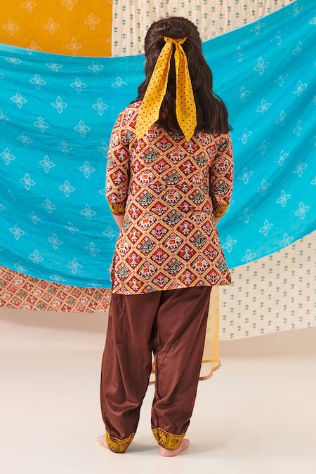 Shop Cute Couture Brown Muslin Silk Print Folklore Kurta And Patola Pant Set at Aza Fashions Shop_Cute Couture_Brown Muslin Silk Print Folklore Kurta And Patola Pant Set _at_Aza_Fashions