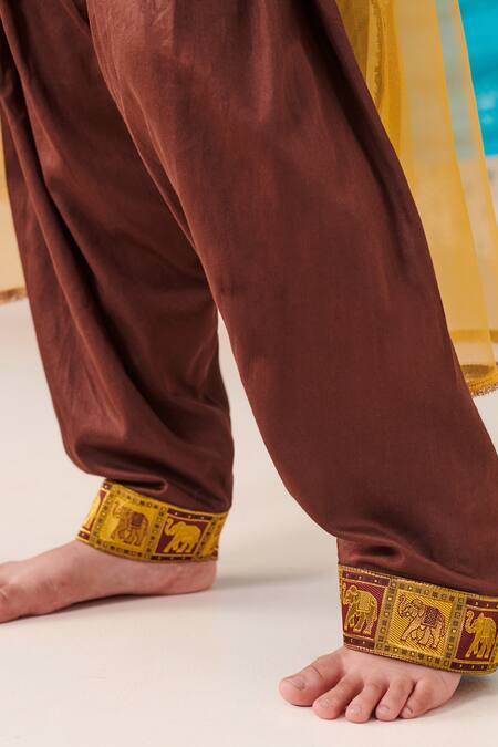 Cute Couture Brown Muslin Silk Print Folklore Kurta And Patola Pant Set at Aza Fashions Cute Couture_Brown Muslin Silk Print Folklore Kurta And Patola Pant Set _at_Aza_Fashions