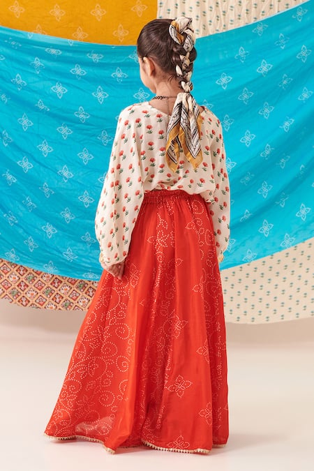 Shop Cute Couture Red Silk Print Phool Top With Bandhani Bloom Lehenga at Aza Fashions Shop_Cute Couture_Red Silk Print Phool Top With Bandhani Bloom Lehenga _at_Aza_Fashions