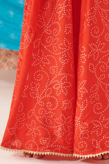 Cute Couture Red Silk Print Phool Top With Bandhani Bloom Lehenga at Aza Fashions Cute Couture_Red Silk Print Phool Top With Bandhani Bloom Lehenga _at_Aza_Fashions