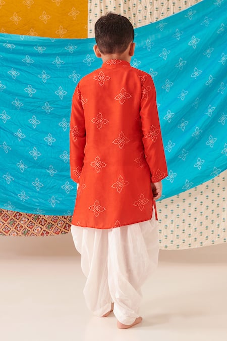 Shop Cute Couture Red Silk Print Bandhani And Blossom Flap Kurta With Dhoti Pant at Aza Fashions Shop_Cute Couture_Red Silk Print Bandhani And Blossom Flap Kurta With Dhoti Pant _at_Aza_Fashions