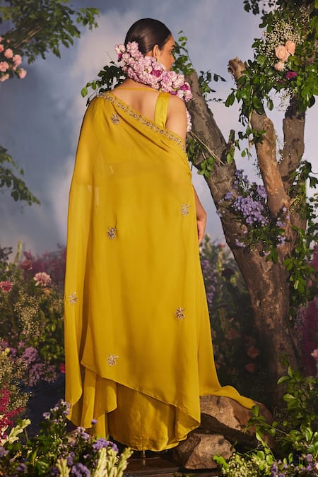 Shop Miku Kumar Yellow Modal, Kalika Zardozi Embroidered Floral Asymmetric Cape Draped Skirt Set at Aza Fashions Shop_Miku Kumar_Yellow Modal, Kalika Zardozi Embroidered Floral Asymmetric Cape Draped Skirt Set _at_Aza_Fashions