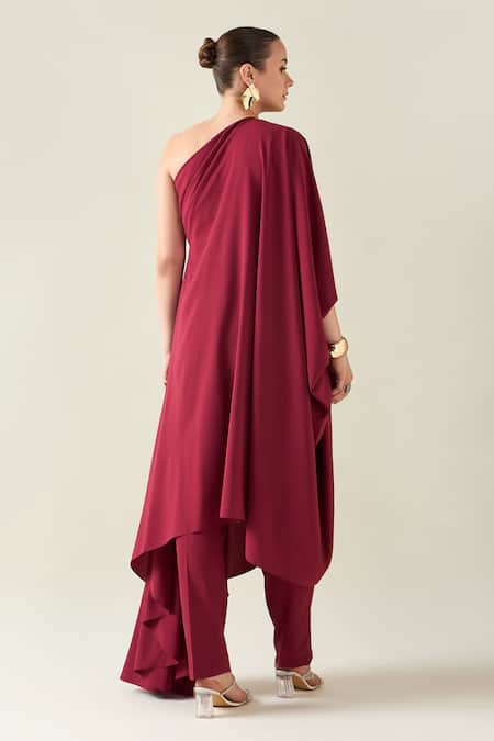 Shop Aakaar Wine Modal Asymmetric One Shoulder Draped Tunic And Pant Set at Aza Fashions Shop_Aakaar_Wine Modal Asymmetric One Shoulder Draped Tunic And Pant Set _at_Aza_Fashions