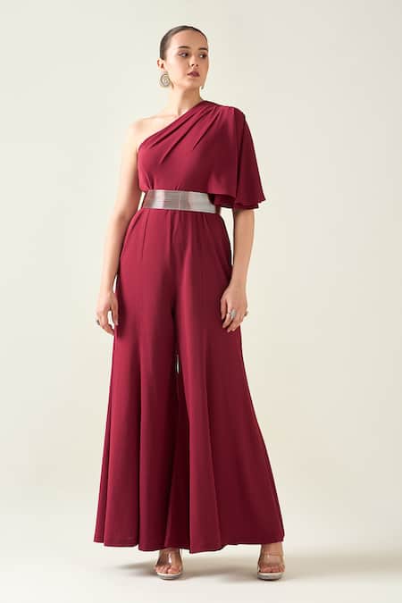 Buy Aakaar Wine Microfiber One Shoulder Alloy Asymmetric Flared Jumpsuit With Metallic Belt Online at Aza Fashions Buy_Aakaar_Wine Microfiber One Shoulder Alloy Asymmetric Flared Jumpsuit With Metallic Belt _Online_at_Aza_Fashions