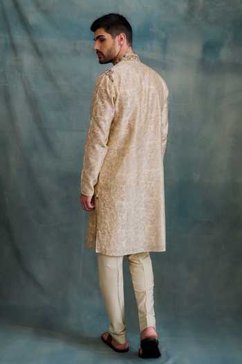Shop Krishna Mehta Beige Tussar Embroidery Paisley Block Print Kurta With Churidar at Aza Fashions Shop_Krishna Mehta_Beige Tussar Embroidery Paisley Block Print Kurta With Churidar _at_Aza_Fashions