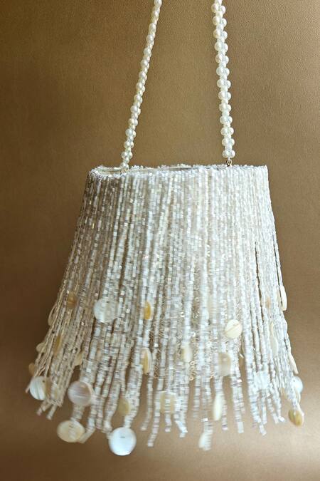 Plode_White Cut Work, Sequins Cutdana Tassel Embellished Potli _Online_at_Aza_Fashions