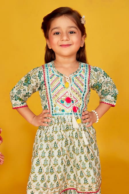 Maaikid White Cotton Tassels, Diamonds Floral Print Peplum Kurta With Palazzo at Aza Fashions Maaikid_White Cotton Tassels, Diamonds Floral Print Peplum Kurta With Palazzo _at_Aza_Fashions