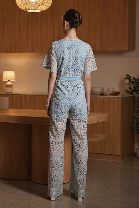 Shop Label Deepika Nagpal Blue Viscose, Crepe Embroidery V-neck Jiselle Cutwork Floral Jumpsuit at Aza Fashions Shop_Label Deepika Nagpal_Blue Viscose, Crepe Embroidery V-neck Jiselle Cutwork Floral Jumpsuit _at_Aza_Fashions