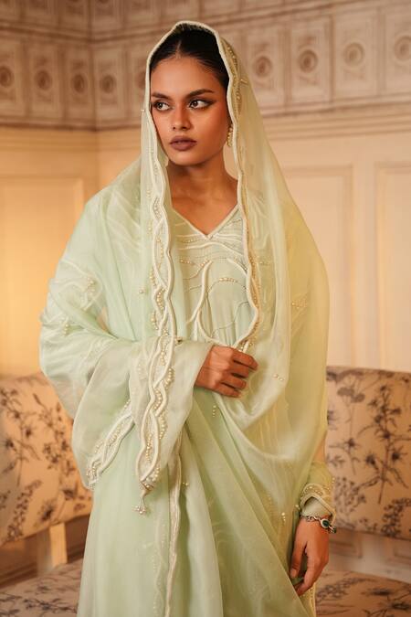 Midushi Bajoria_Green Organza, Crepe Pearls, Tassels V-neck Embellished Kurta Pant Set _at_Aza_Fashions