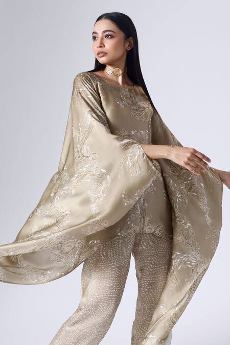 Klad Beige Satin Round Neck Lotus Print Poncho Top And Pant Set at Aza Fashions Klad_Beige Satin Round Neck Lotus Print Poncho Top And Pant Set_at_Aza_Fashions