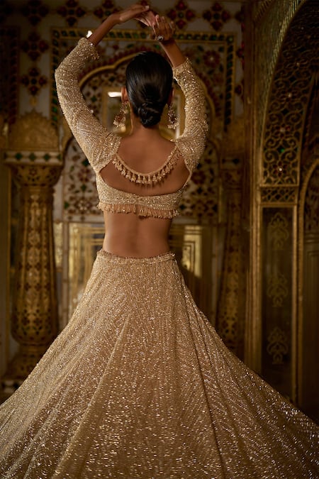 Shop_Seema Gujral_Gold Net Crystals, Sequins, Beads, Tassels Embroidered Bridal Lehenga Set _at_Aza_Fashions