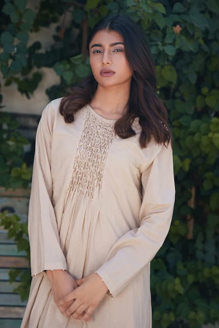 OurDve Ivory Cotton Pearls Round Neck Embellished Yoke Dress at Aza Fashions OurDve_Ivory Cotton Pearls Round Neck Embellished Yoke Dress _at_Aza_Fashions