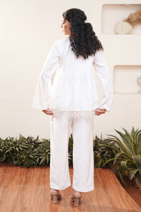 Shop OurDve White Cotton Cut Work, Embroidery Round Neck Pleated Top And Pant Set at Aza Fashions Shop_OurDve_White Cotton Cut Work, Embroidery Round Neck Pleated Top And Pant Set _at_Aza_Fashions