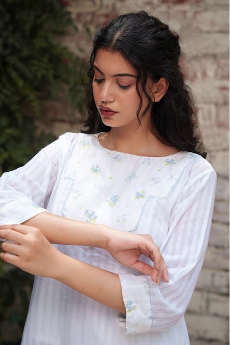 Shop Ourdve White Cotton Embroidery Round Neck Asymmetric Tunic And Pant Set at Aza Fashions Shop_Ourdve_White Cotton Embroidery Round Neck Asymmetric Tunic And Pant Set _at_Aza_Fashions