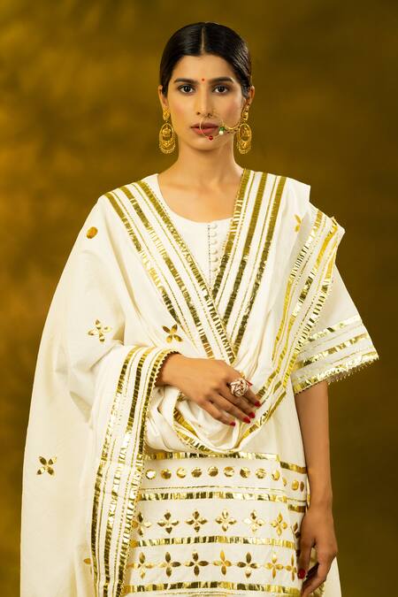 Shop_Shivani Sabharwal_White Cotton Embroidery, Gota Patti Round Neck Gold Kurta Sharara Set _Online_at_Aza_Fashions