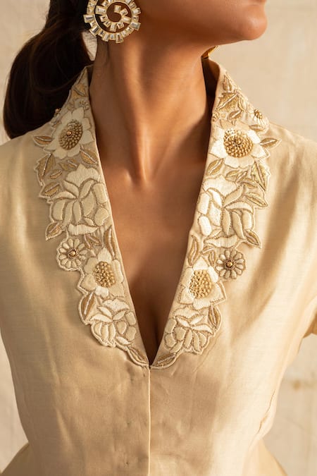 Shop_Neitri_Beige Chanderi Silk Embroidery V-neck Wave Floral Cutwork Peplum Blouse _Online_at_Aza_Fashions