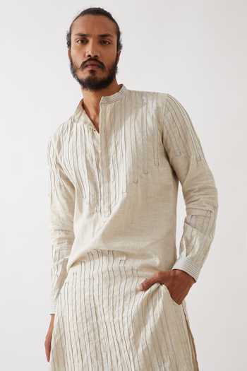 Son Of A Noble Snob Ivory Linen Gabriel Pintuck And Stitchline Embroidered Kurta With Trouser at Aza Fashions Son Of A Noble Snob_Ivory Linen Gabriel Pintuck And Stitchline Embroidered Kurta With Trouser _at_Aza_Fashions