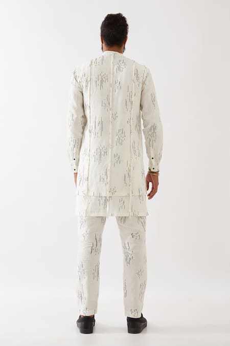 Shop Son Of A Noble Snob White Linen Carson Meteor Pintuck Kurta With Trousers at Aza Fashions Shop_Son Of A Noble Snob_White Linen Carson Meteor Pintuck Kurta With Trousers _at_Aza_Fashions