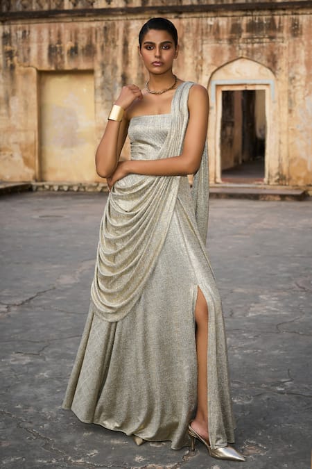 Dash And Dot Silver Polyester Off-shoulder Metallic Draped Saree Style Gown at Aza Fashions Dash And Dot_Silver Polyester Off-shoulder Metallic Draped Saree Style Gown _at_Aza_Fashions