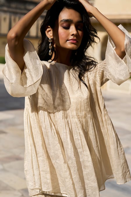 Dash And Dot Ivory Silk, Cotton, Lurex Round Neck Stripe Patterned Peplum Top Online at Aza Fashions Dash And Dot_Ivory Silk, Cotton, Lurex Round Neck Stripe Patterned Peplum Top _Online_at_Aza_Fashions