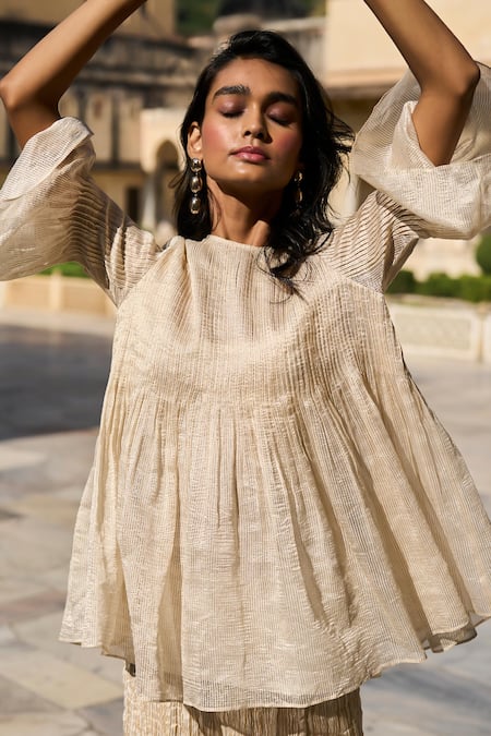 Dash And Dot Ivory Silk, Cotton, Lurex Round Neck Stripe Patterned Peplum Top at Aza Fashions Dash And Dot_Ivory Silk, Cotton, Lurex Round Neck Stripe Patterned Peplum Top _at_Aza_Fashions