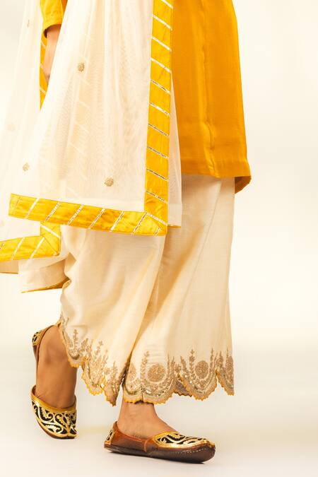 Shop Shivani Sabharwal Yellow Crepe, Silk, Net Dori Thread Embroidered Short Kurta Flared Pant Set Online at Aza Fashions Shop_Shivani Sabharwal_Yellow Crepe, Silk, Net Dori Thread Embroidered Short Kurta Flared Pant Set _Online_at_Aza_Fashions