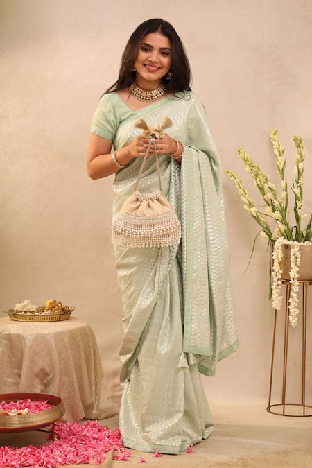 Shop Amyra Ivory Cut Work, Pearls Anahi Tussar Brocade Potli Bag at Aza Fashions Shop_Amyra_Ivory Cut Work, Pearls Anahi Tussar Brocade Potli Bag _at_Aza_Fashions
