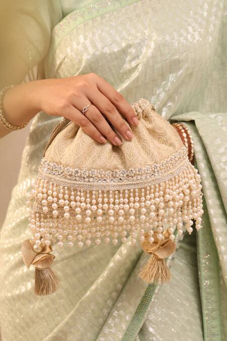 Buy Amyra Ivory Cut Work, Pearls Anahi Tussar Brocade Potli Bag Online at Aza Fashions Buy_Amyra_Ivory Cut Work, Pearls Anahi Tussar Brocade Potli Bag _Online_at_Aza_Fashions